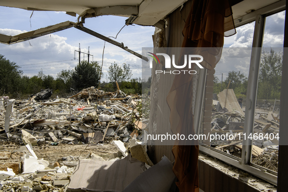 A residential building in a village in the Kyiv region is being heavily damaged during a massive Russian missile and drone attack on Ukraine...