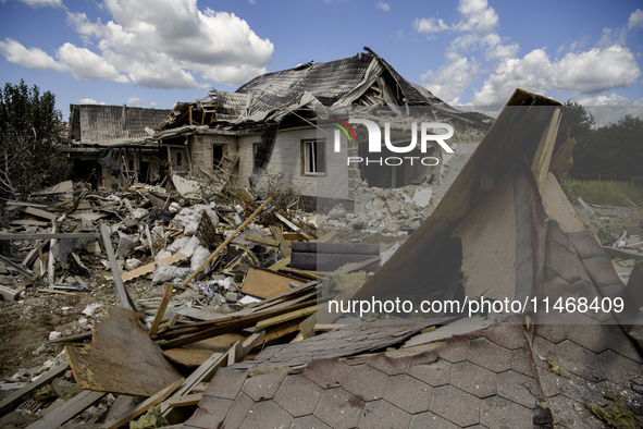 A residential building in a village in the Kyiv region is being heavily damaged during a massive Russian missile and drone attack on Ukraine...