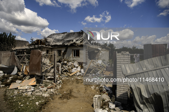 A residential building in a village in the Kyiv region is being heavily damaged during a massive Russian missile and drone attack on Ukraine...