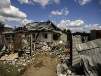 A residential building in a village in the Kyiv region is being heavily damaged during a massive Russian missile and drone attack on Ukraine...