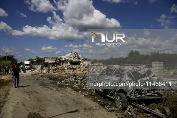 A residential building in a village in the Kyiv region is being heavily damaged during a massive Russian missile and drone attack on Ukraine...