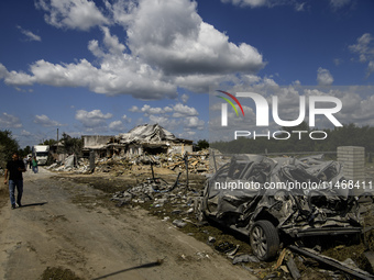 A residential building in a village in the Kyiv region is being heavily damaged during a massive Russian missile and drone attack on Ukraine...