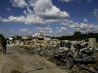 A residential building in a village in the Kyiv region is being heavily damaged during a massive Russian missile and drone attack on Ukraine...