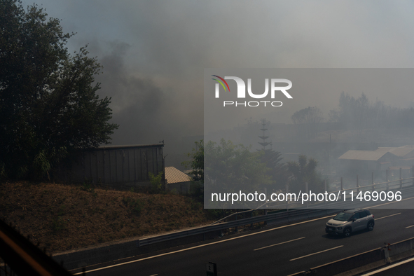 A fire is breaking out in Naples, Italy, on Sunday, in the Capodichino Airport area. The cloud of smoke is invading the A56 at the height of...