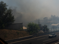 A fire is breaking out in Naples, Italy, on Sunday, in the Capodichino Airport area. The cloud of smoke is invading the A56 at the height of...