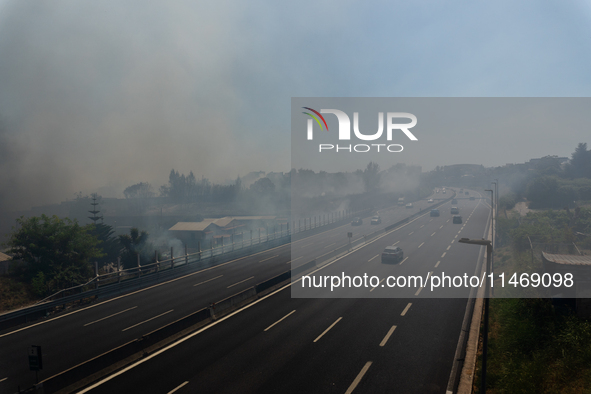 A fire is breaking out in Naples, Italy, on Sunday, in the Capodichino Airport area. The cloud of smoke is invading the A56 at the height of...