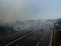 A fire is breaking out in Naples, Italy, on Sunday, in the Capodichino Airport area. The cloud of smoke is invading the A56 at the height of...