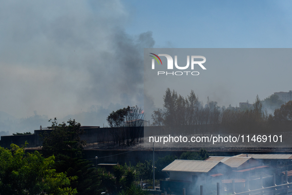 A fire is breaking out in Naples, Italy, on Sunday, in the Capodichino Airport area. The cloud of smoke is invading the A56 at the height of...