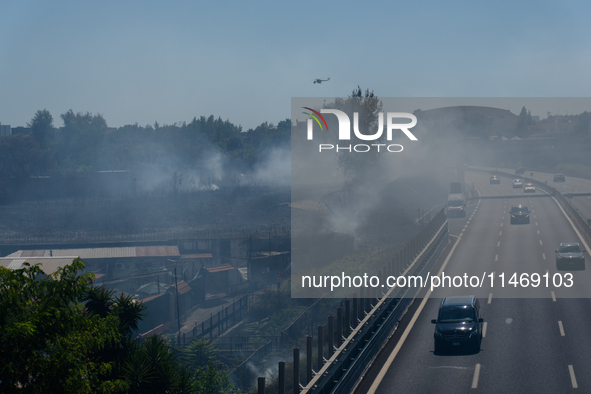 A fire is breaking out in Naples, Italy, on Sunday, in the Capodichino Airport area. The cloud of smoke is invading the A56 at the height of...