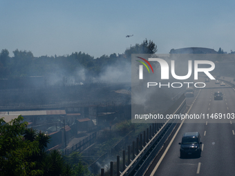 A fire is breaking out in Naples, Italy, on Sunday, in the Capodichino Airport area. The cloud of smoke is invading the A56 at the height of...