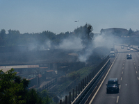 A fire is breaking out in Naples, Italy, on Sunday, in the Capodichino Airport area. The cloud of smoke is invading the A56 at the height of...