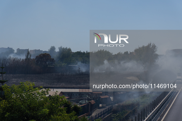 A fire is breaking out in Naples, Italy, on Sunday, in the Capodichino Airport area. The cloud of smoke is invading the A56 at the height of...