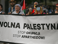 KRAKOW, POLAND - AUGUST 10:
Pro-Palestinian activists rally in Krakow's UNESCO-listed Old Town during the 'March for Palestine,' advocating...