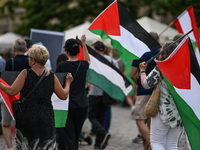 KRAKOW, POLAND - AUGUST 10:
Pro-Palestinian activists rally in Krakow's UNESCO-listed Old Town during the 'March for Palestine,' advocating...