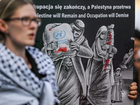 KRAKOW, POLAND - AUGUST 10:
Pro-Palestinian activists rally in Krakow's UNESCO-listed Old Town during the 'March for Palestine,' advocating...