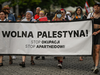 KRAKOW, POLAND - AUGUST 10:
Pro-Palestinian activists rally in Krakow's UNESCO-listed Old Town during the 'March for Palestine,' advocating...