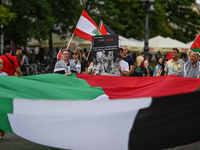 KRAKOW, POLAND - AUGUST 10:
Pro-Palestinian activists rally in Krakow's UNESCO-listed Old Town during the 'March for Palestine,' advocating...