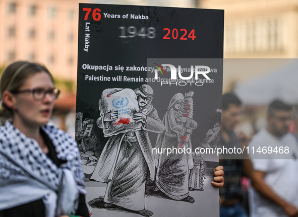 KRAKOW, POLAND - AUGUST 10:
Pro-Palestinian activists rally in Krakow's UNESCO-listed Old Town during the 'March for Palestine,' advocating...