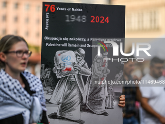 KRAKOW, POLAND - AUGUST 10:
Pro-Palestinian activists rally in Krakow's UNESCO-listed Old Town during the 'March for Palestine,' advocating...