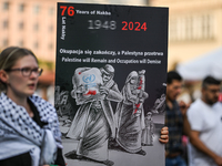 KRAKOW, POLAND - AUGUST 10:
Pro-Palestinian activists rally in Krakow's UNESCO-listed Old Town during the 'March for Palestine,' advocating...