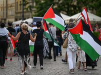 KRAKOW, POLAND - AUGUST 10:
Pro-Palestinian activists rally in Krakow's UNESCO-listed Old Town during the 'March for Palestine,' advocating...