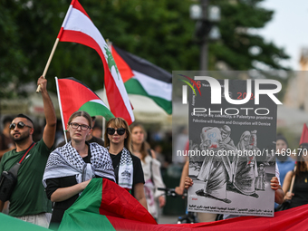 KRAKOW, POLAND - AUGUST 10:
Pro-Palestinian activists rally in Krakow's UNESCO-listed Old Town during the 'March for Palestine,' advocating...