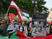 KRAKOW, POLAND - AUGUST 10:
Pro-Palestinian activists rally in Krakow's UNESCO-listed Old Town during the 'March for Palestine,' advocating...