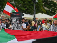 KRAKOW, POLAND - AUGUST 10:
Pro-Palestinian activists rally in Krakow's UNESCO-listed Old Town during the 'March for Palestine,' advocating...