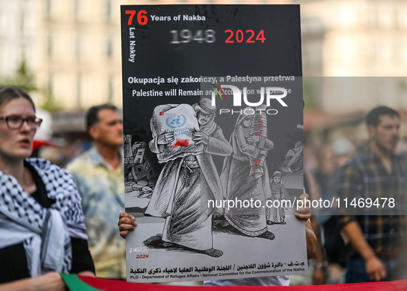 KRAKOW, POLAND - AUGUST 10:
Pro-Palestinian activists rally in Krakow's UNESCO-listed Old Town during the 'March for Palestine,' advocating...