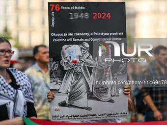 KRAKOW, POLAND - AUGUST 10:
Pro-Palestinian activists rally in Krakow's UNESCO-listed Old Town during the 'March for Palestine,' advocating...