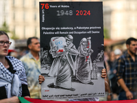 KRAKOW, POLAND - AUGUST 10:
Pro-Palestinian activists rally in Krakow's UNESCO-listed Old Town during the 'March for Palestine,' advocating...