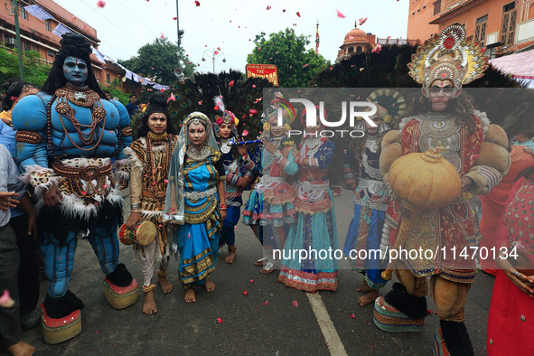 Artists are participating in the annual religious 'Lakhi Pad Yatra' for the 'darshan' of Lord Kalyan at Diggi Kalyan Ji temple in Jaipur, Ra...