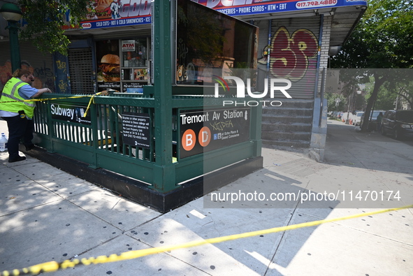 Blood is on the sidewalk and steps outside of the Tremont Av station. Two men are being slashed outside of the Tremont Avenue subway station...