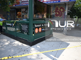 Blood is on the sidewalk and steps outside of the Tremont Av station. Two men are being slashed outside of the Tremont Avenue subway station...