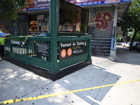 Blood is on the sidewalk and steps outside of the Tremont Av station. Two men are being slashed outside of the Tremont Avenue subway station...