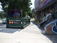 Blood is on the sidewalk and steps outside of the Tremont Av station. Two men are being slashed outside of the Tremont Avenue subway station...