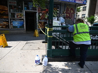 Blood is on the sidewalk and steps outside of the Tremont Av station. Two men are being slashed outside of the Tremont Avenue subway station...