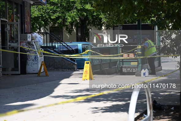 Blood is on the sidewalk and steps outside of the Tremont Av station. Two men are being slashed outside of the Tremont Avenue subway station...