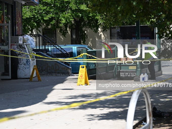 Blood is on the sidewalk and steps outside of the Tremont Av station. Two men are being slashed outside of the Tremont Avenue subway station...