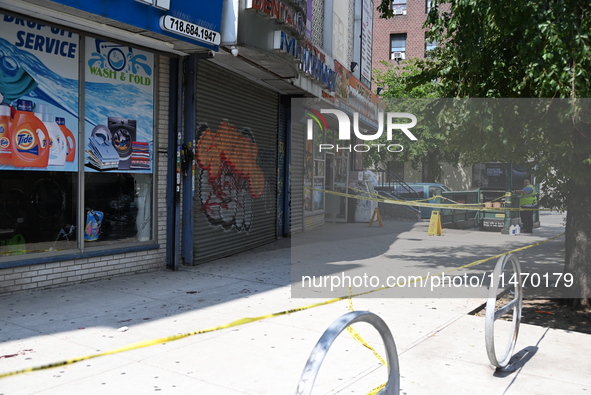 Blood is on the sidewalk and steps outside of the Tremont Av station. Two men are being slashed outside of the Tremont Avenue subway station...