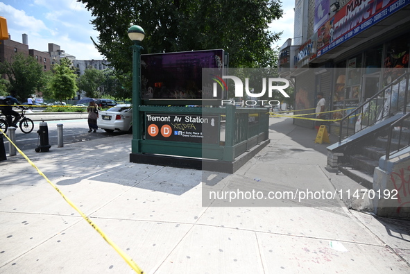 Blood is on the sidewalk and steps outside of the Tremont Av station. Two men are being slashed outside of the Tremont Avenue subway station...