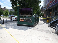 Blood is on the sidewalk and steps outside of the Tremont Av station. Two men are being slashed outside of the Tremont Avenue subway station...