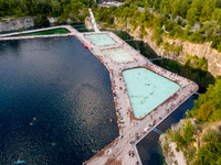 An aerial view of people refreshing and sunbathing during a warm evening in Zakrzowek, a popular resort in Krakow, Poland on August 11, 2024...