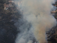 A forest fire is burning near the village of Larbaa Nath Reten, Tizi Ouzou, in the mountainous region of Kabyle, Algeria, on August 11, 2024...