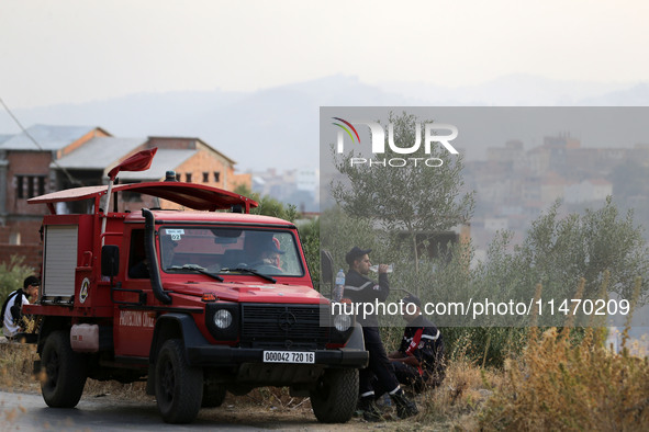 A forest fire is burning near the village of Larbaa Nath Reten, Tizi Ouzou, in the mountainous region of Kabyle, Algeria, on August 11, 2024...