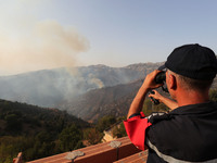 A forest fire is burning near the village of Larbaa Nath Reten, Tizi Ouzou, in the mountainous region of Kabyle, Algeria, on August 11, 2024...