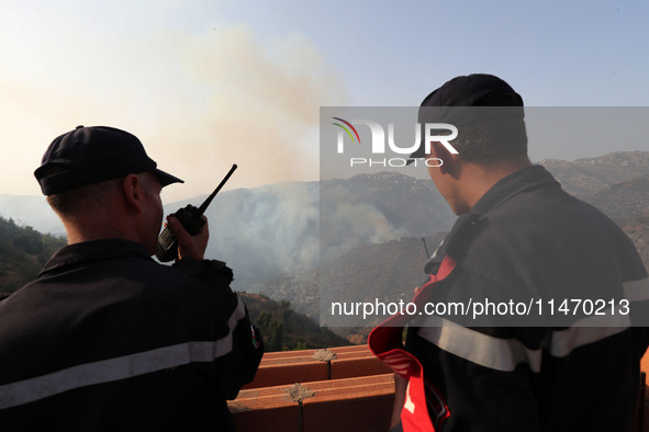 A forest fire is burning near the village of Larbaa Nath Reten, Tizi Ouzou, in the mountainous region of Kabyle, Algeria, on August 11, 2024...