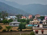 Houses are standing in a rural area just outside the town of Haldwani, Uttarakhand, India, on April 23, 2024. (