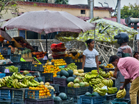 People are buying fresh fruit at a fruit stand along the roadside in Haldwani, Uttarakhand, India, on April 23, 2024. (