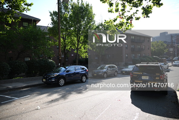 Police are present at the crime scene. A 33-year-old male is being killed in a shooting in Passaic, New Jersey, United States, on August 11,...